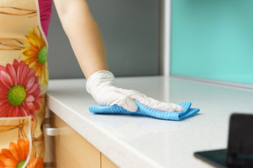 Local stain removal specialist inspecting a fabric surface