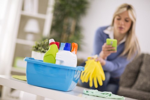 Staff member wearing PPE while carrying out cleaning duties
